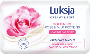 Białe mydło w kostce Luksja Creamy & Soft Róża i Proteiny Mleka, z dużą różową różą, widok z przodu.