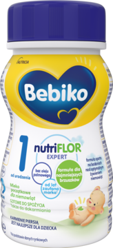 Bebiko 1 NUTRIflor Expert, płynne mleko początkowe, butelka biało-żółta, bez oleju palmowego, widok z przodu.