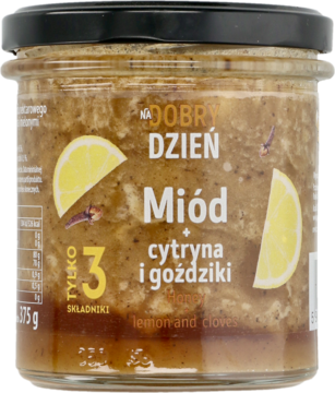 Miód Na Dobry Dzień cytryna i goździki w szklanym słoiku, gęsty, z owocami na etykiecie, widok z przodu.