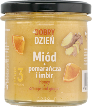 Słoik miodu Dobry Dzień z pomarańczą i imbirem, kremowa zawartość, czarna nakrętka, widok z przodu.