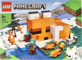 LEGO Minecraft The Fox Lodge 21178 set, showing an orange fox-shaped house, minifigures, and snow scene on the box.