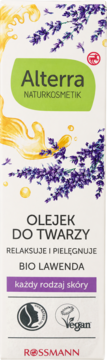 Alterra Naturkosmetik Olejek do Twarzy Bio Lawenda w białym opakowaniu z zieloną etykietą, złoty olejek i fioletowa lawenda.
