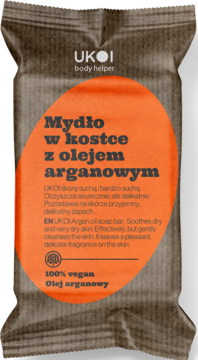 Mydło w kostce UKOI z olejem arganowym w brązowym opakowaniu z pomarańczowym owalem, 100% wegańskie, dla suchej skóry.