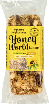 Ręcznie wykonany baton Honey World słonecznik, miód, płatki owsiane w folii, z żółtą etykietą, bez cukru.