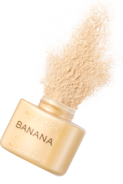 Sypki puder Revolution Banana Baking Powder w otwartym, złotym słoiczku, z którego wysypuje się beżowy proszek.
