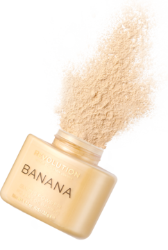 Sypki puder Revolution Banana Baking Powder w otwartym, złotym słoiczku, z którego wysypuje się beżowy proszek.