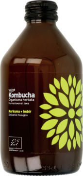 Brązowa butelka VIGO Kombucha Kurkuma+Imbir, z czarną nakrętką i etykietą z dużym żółto-zielonym kwiatem. Widok z przodu.