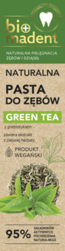 Naturalna pasta do zębów Bio Madent Green Tea, zielono-brązowe opakowanie z liśćmi herbaty, widok z przodu.
