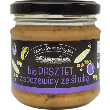 Słoik bio pasztetu Farma Świętokrzyska z soczewicy ze śliwką, ciemna etykieta, widok z przodu, z ilustracjami warzyw.
