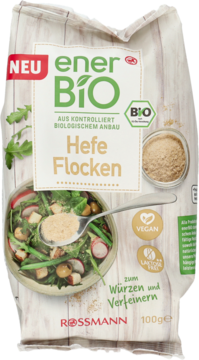 Białe opakowanie enerBiO Bio Hefe Flocken (płatki drożdżowe) Rossmann, wegańskie, do przyprawiania, widok z przodu.