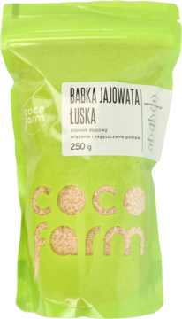Zielona torebka Coco Farm z babką jajowatą łuską 250g, brązowy błonnik widoczny przez opakowanie.
