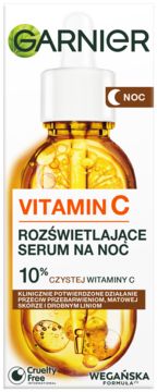 Garnier Vitamin C rozświetlające serum na noc 10%, w butelce z bursztynowym płynem i pęcherzykami.