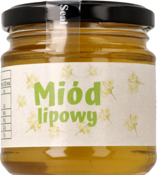 Bursztynowy miód lipowy w przezroczystym słoiku z białą etykietą z zielonym napisem i kwiatami.