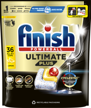 Finish Ultimate Plus Lemon, 36 kapsułek do zmywarki w czarno-złotej torbie, widok z przodu z błyszczącym kieliszkiem.
