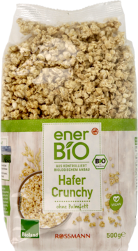 Paczka enerBiO Hafer Crunchy 500g, transparentna z zielono-białą etykietą, miską owsianych płatków i napisem 'vegan', widok z przodu.