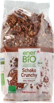 EnerBio Schoko Crunchy 500g w przezroczystej torbie, widok z przodu, z brązowymi chrupkami i zielonym logo.