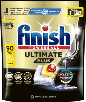 Finish Ultimate Plus Lemon 90 kapsułek do zmywarki, w złoto-czarnej torebce z lśniącą szklanką i tabletkami.