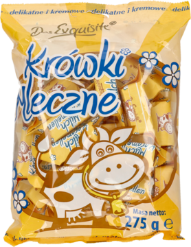 Żółta torebka cukierków Krówki Mleczne D. Exquisite 275g z uśmiechniętą krową i białymi kwiatami, widok z przodu.