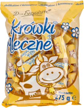 Żółta torebka cukierków Krówki Mleczne D. Exquisite 275g z uśmiechniętą krową i białymi kwiatami, widok z przodu.