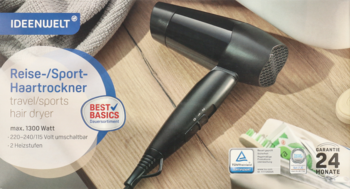 Czarna składana suszarka podróżno-sportowa Ideenwelt 1200W, leżąca na drewnianym blacie, widok z góry, kompaktowa.