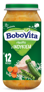 Słoik BoboVita risotto z indykiem dla dzieci 12+ miesięcy, z zieloną etykietą i grafiką warzyw.