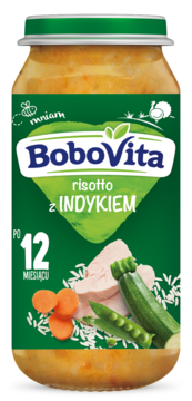 Słoik BoboVita risotto z indykiem dla dzieci 12+ miesięcy, z zieloną etykietą i grafiką warzyw.
