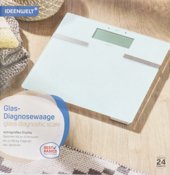 Biała szklana waga diagnostyczna z dużym wyświetlaczem, widok z góry na jasnym, teksturowanym tle.