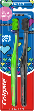 Dwie szczoteczki Colgate Ultra Soft w blistrze, zielona i czarna, na niebieskim tle z pixelowymi sercami.