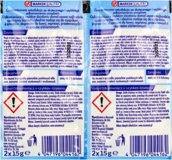 Dwa opakowania silnego odkamieniacza domol 2x15g w biało-niebieskich saszetkach, widok z przodu.