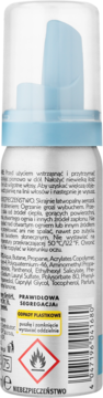 Tył białej pianki do włosów ISANA Power Ultra, z niebieskim dozownikiem, widoczne instrukcje i symbol łatwopalności.