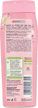 Tył różowej butelki szamponu ISANA Silky Shine z ekstraktem magnolii i lotosu, widoczny kod kreskowy.