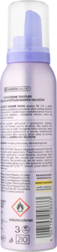 Tylna strona fioletowej pianki do włosów Isana Volume z tekstem, kodem kreskowym i symbolem zagrożenia.