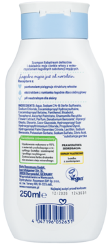 Tył białej butelki szamponu Babydream 250ml z niebieską nakrętką, widoczne polskie napisy, składniki i kod kreskowy.