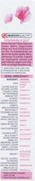 Tył Alterra Bio-Orchid Eye Cream z opisem produktu i listą składników. U góry różowe płatki orchidei.