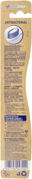 Tył beżowego opakowania antybakteryjnej szczoteczki, z informacją o 99,99% skuteczności i kodem.