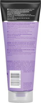 Tył fioletowej tubki odżywki John Frieda Violet Crush do włosów blond, z informacjami o produkcie i kodem.