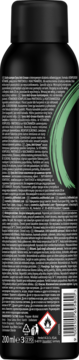Tył czarnej butelki suchego szamponu Syoss Classic z zielonym logo, widoczny kod kreskowy i etykieta ostrzegawcza.