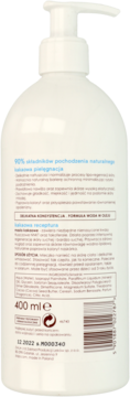 Tył białej butelki wegańskiego balsamu do ciała z masłem kakaowym, z opisem 90% składników naturalnych.