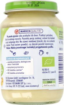 Tył szklanego słoika z ekologicznym przecierem jabłkowo-bananowym i twarożkiem, widoczny opis i certyfikaty.