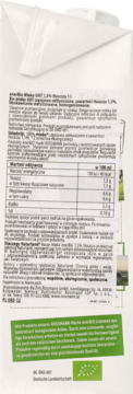 Tył białego kartonu mleka bio 1,5% tłuszczu, widok od góry z zamknięciem i tabelą wartości odżywczych.
