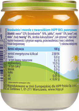 Tylna etykieta musu HiPP BIO z brzoskwiniami i morelami, z tabelą wartości odżywczych, na tle słońca.