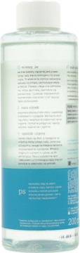 Tył butelki z olejkiem PS do skóry 200ml, przezroczysta ciecz, niebieska etykieta z polskim opisem właściwości.