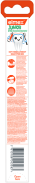 Tylne opakowanie miękkiej szczoteczki Elmex Junior dla dzieci, z opisem produktu i kodem kreskowym.