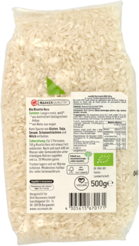 Tył opakowania enerBio ryżu risotto, białe ziarna, widoczne etykiety z niemieckim opisem i wartościami.