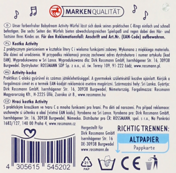 Tył opakowania edukacyjnej Kostki-Activity, z kodem EAN, widocznymi informacjami o producencie i recyklingu w kilku językach.