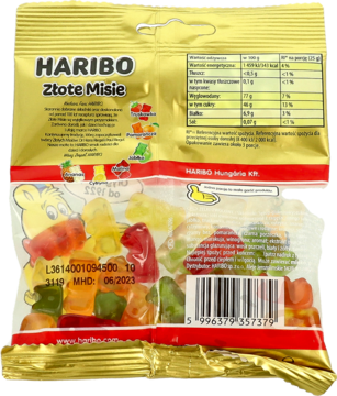 Tył złotego opakowania Haribo Złote Misie z przezroczystym okienkiem, widoczne kolorowe żelki i tabela.