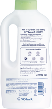 Tył białej butelki HiPP Babysanft Sensitive płynu do kąpieli 1000 ml, z zieloną nakrętką i składnikami.
