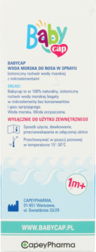 Tył opakowania Babycap Woda Morska do Nosa w sprayu, biało-niebieskie, z polskimi informacjami i symbolem 1m+.