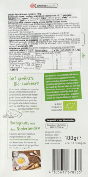Tylna etykieta Bio Paluszków serowych 100g z tekstem, zdjęciem mąki, opisem ‘Bio-Knabberei’ i kodem kreskowym.