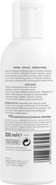 Tył białej butelki Satynowej odżywki do włosów zniszczonych, z polskim tekstem i listą składników, 200ml.